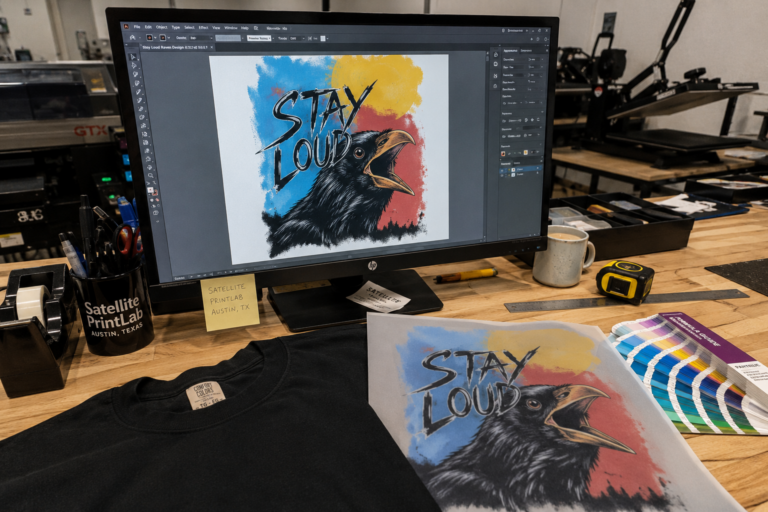 Print ready artwork being prepared for custom T-shirt printing at Satellite PrintLab in Austin, Texas